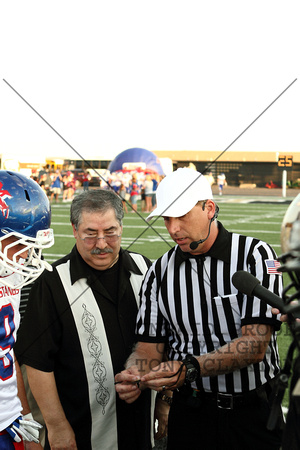 Mike Abusaab And A Referee Looking At The Coin