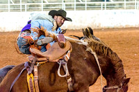 Pickup Man Taking A Rider Off A Bucking Horse