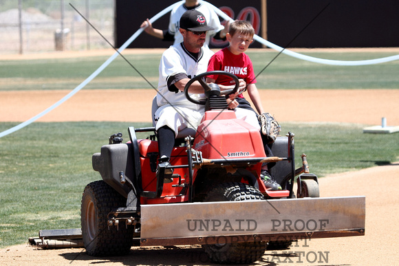 Coach Britt Smith Dragging The Infield With Logan