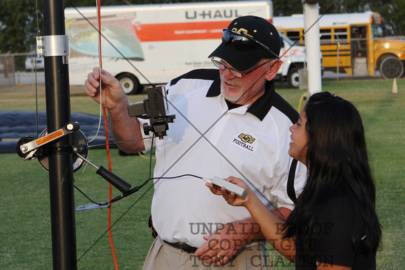 Coach Sparks And An Assistant Setting Up The End Zone Camera
