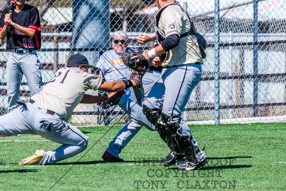Matthew Tarrats Tagging Out The Base Runner Between Third And Ho