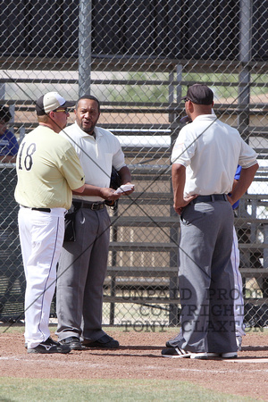 Coach Otto Talking With The Umpires And Fort Stockton Coach Before The Game