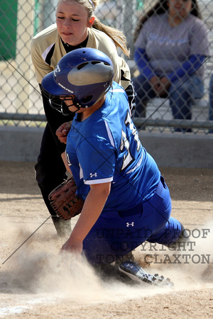 Logan Tagging Out A Runner At Home Plate