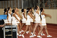 Cheerleaders Leading The Crowd In A Cheer