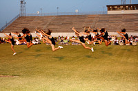 Varsity Cheerleaders Doing A Kick
