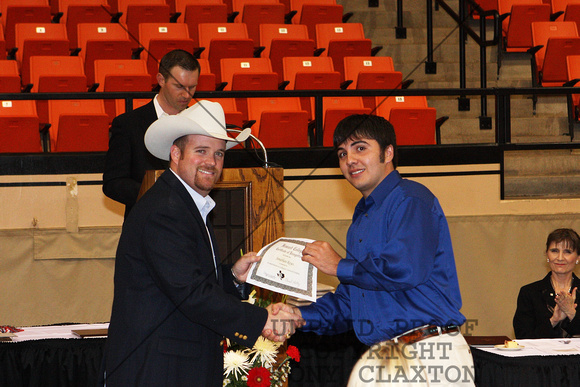 Jonathan Reyes Receiving A Livestock Judging Certificate From Cash Berry