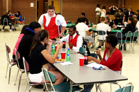 Group Sitting At A Table Eating
