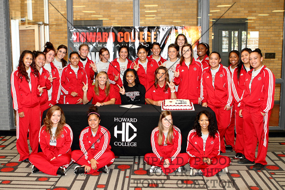 Team Posing With Olive Naotala After Signing