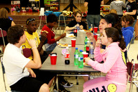 Group Eating And Talking At A Table