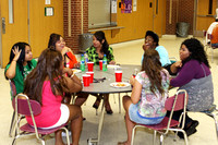 Group Eating And Talking At A Table