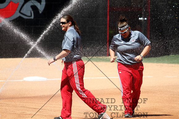 Coaches Kelly Raines And Kaycee Taylor Watering The Infield