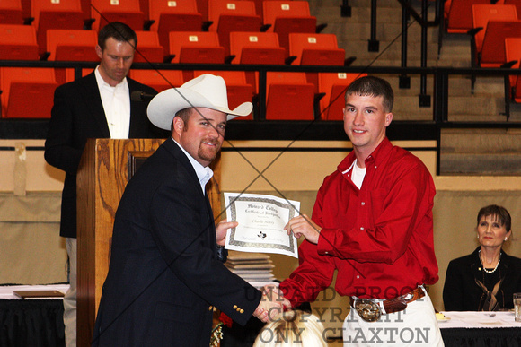 Charlie Hensy Receiving A Certificate For Livestock Judging From Cash Berry