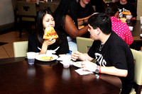 Anjelica and Patrick Eating Pizza