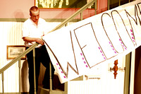 Butch Helping Hang The Welcome Sign