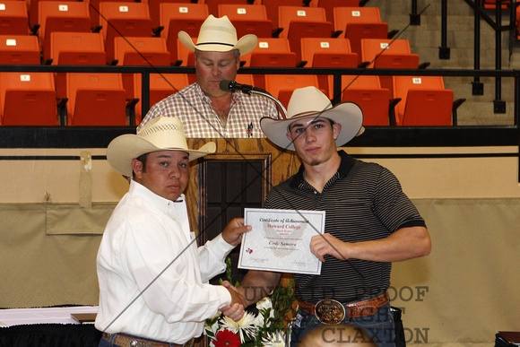 Cody Samora Receiving A Rodeo Certificate From Coach Lester Jourdan