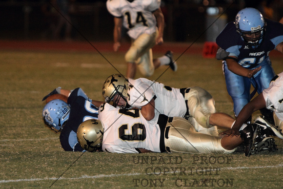 Anthony And Justin Tackling The Ball Carrier