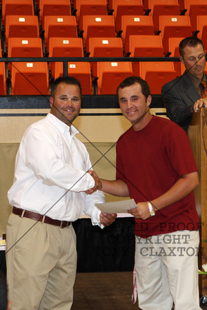 Nick Popescu Receiving A Certificate From Coach Thomas
