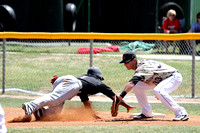 Levi Scott Trying To Tag Out The Runner At First