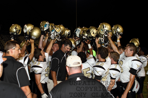 Team Raising Their Helmets After The Win