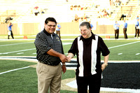 BSISD Superintendent Steven Saldivar Presenting A Coin To Mike Abusaab For The Coin Toss