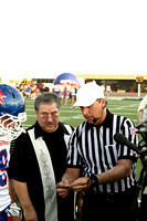 Mike Abusaab And A Referee Looking At The Coin