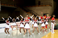 Cheerleaders Leading The Crowd In A Cheer