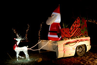Rudolph Pulling Santa In A Pickup Bed