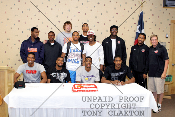 Calvin Godfrey, Leon Cooper, Shavon Coleman And Damien McGee Posing With Their Team