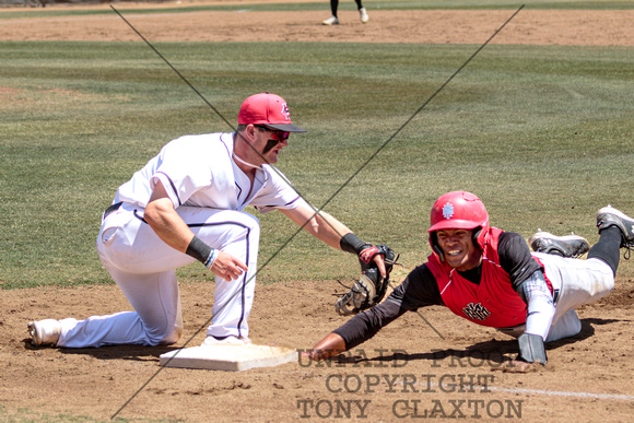 Aaron Manias Tagging A Base Runner Out
