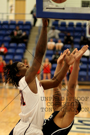Jermaine Winfield Shooting A Layup Over A Defender