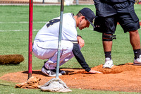 Coach Daniel Carrillo Repairing The Pitcher's Mound
