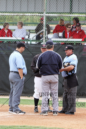 Coach Britt Smith Talking With Frank Phillips Coach And The Officials Before The Game