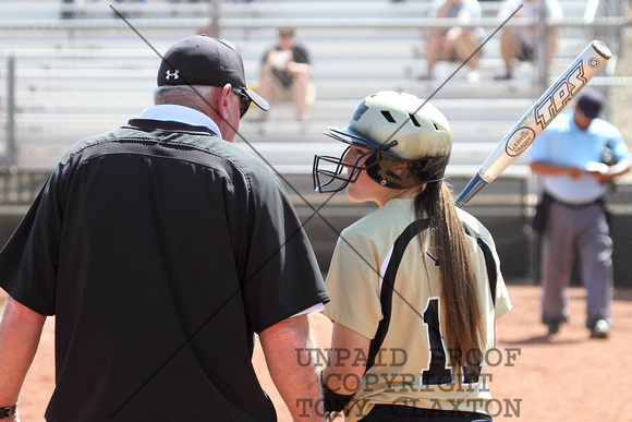 Coach John Sparks And Haley Talking While The Pitcher Warms Up