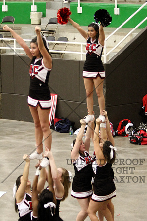Cheerleaders Performing A Stunt