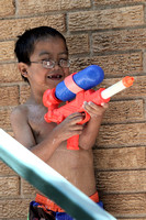 Julian With A Water Gun On The Stairs