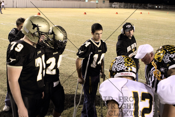 Team Captains Looking At The Coin At The Coin Toss