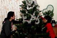 Andrea And Brenda Putting Garland On The Tree