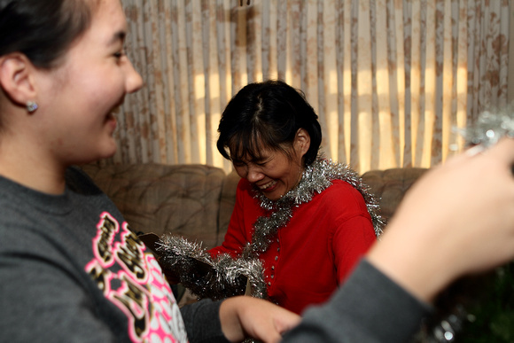 Andrea And Brenda Putting Garland On The Tree