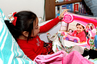 Kaylee Looking At A Toy