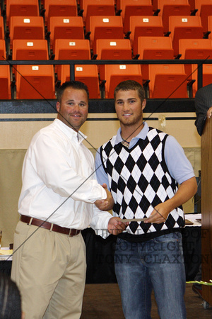 Hunter Hill Receiving A Certificate From Coach Thomas