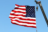 United States Flag Flying From A Crane