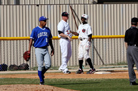 Runey Davis Congratulated By The Third Base Coach After Hitting a Triple