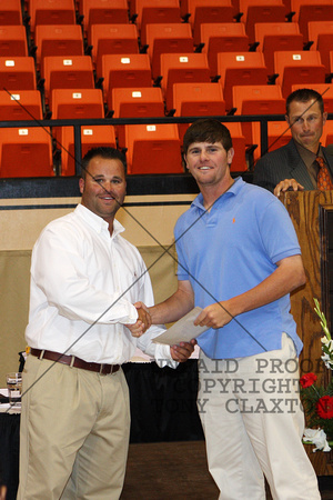 Zach Neal Receiving A Certificate From Coach Thomas