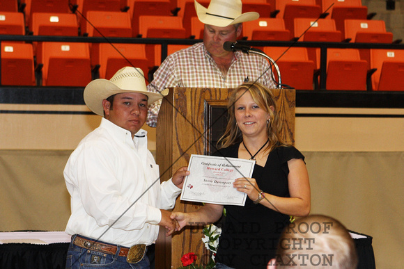 Stevie Davenport Receiving A Rodeo Certificate From Coach Lester Jourdan