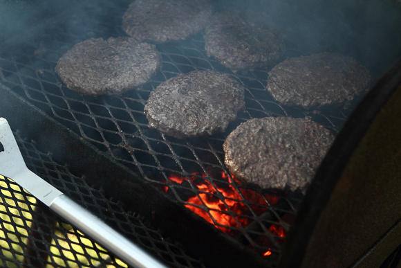 Hamburgers Cooking Over The Fire