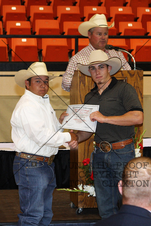 Cody Samora Receiving A Rodeo Certificate For Academic Excellence From Coach Lester Jourdan