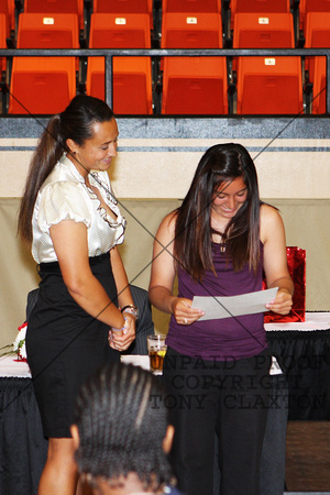 Unknown Softball Player Receiving A Softball Certificate From Aida Esquer