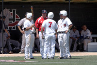 Coach Giese Talking With The Base Runners And Batters During A Time Out