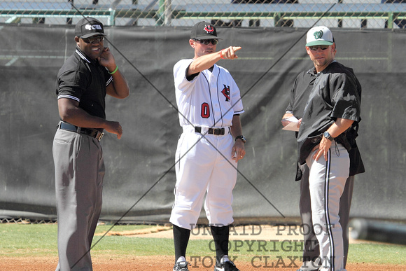 Coach Britt Smith Discussing The Field With The Umpires And WTC's Coach