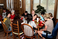 People Sitting At The Table Eating